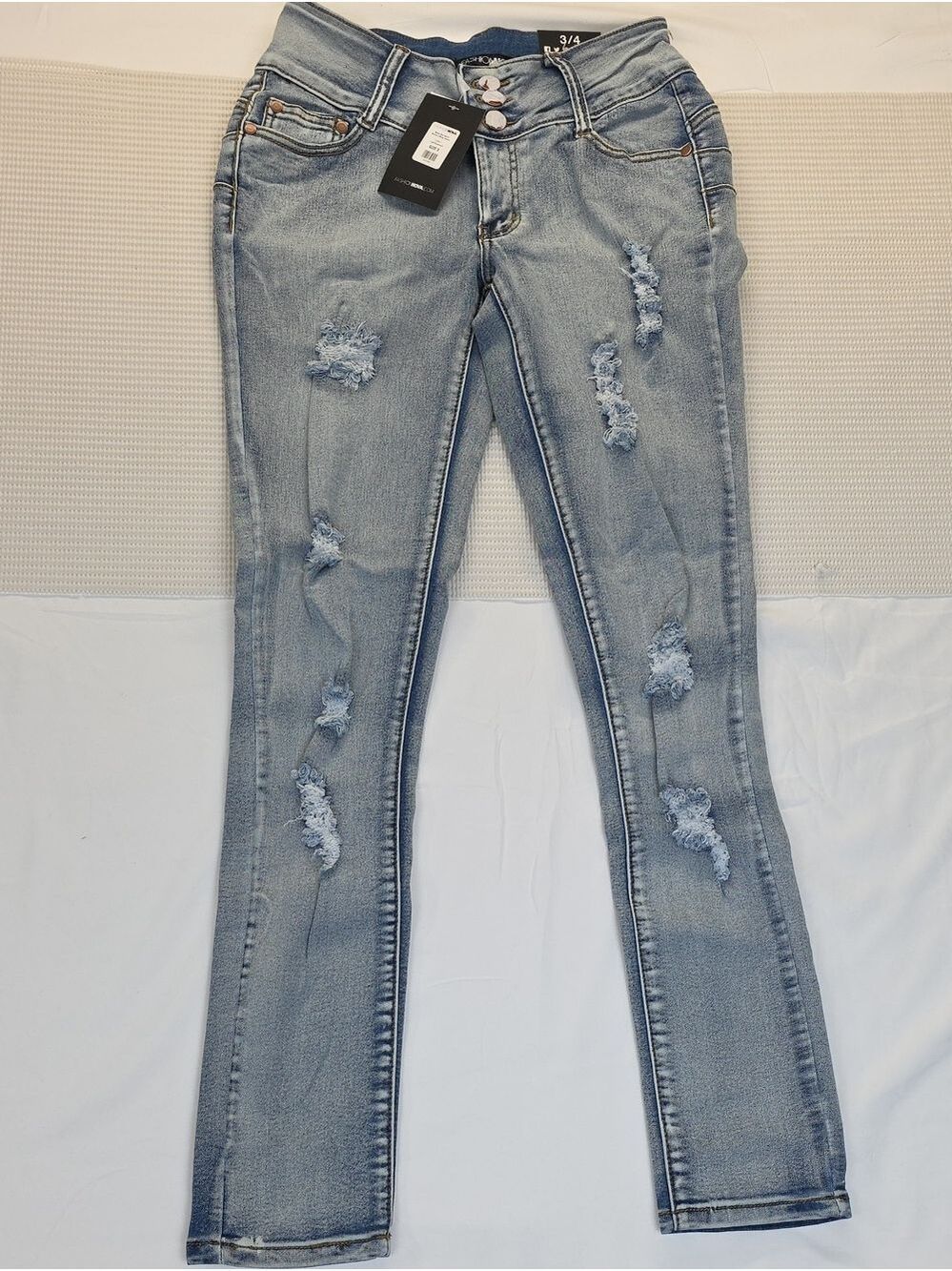 Light Wash Distressed Women’s Jeans - Slim Fit 3/4 Fashion Nova